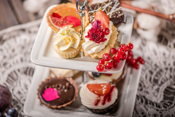 selection of various sweet pastries cakes muffins cupcakes