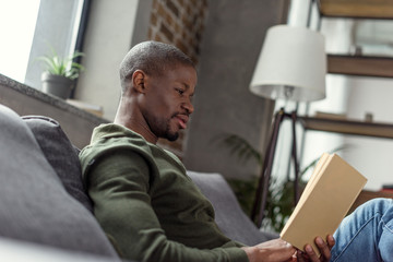 african american man reading book