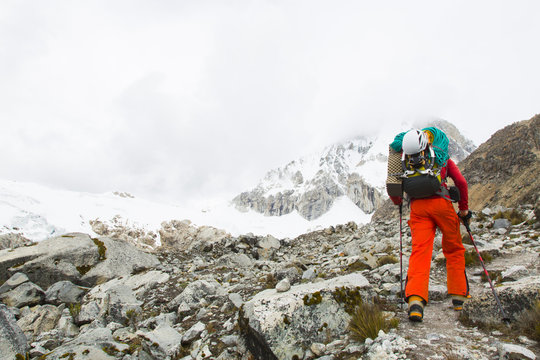 Man ascending to high camp of Ranrapalca, Ishinca Valley, Pashpa, Huaraz, Ancash, Cordillera Blanca, Peru