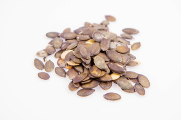 Pumpkin seeds on a white background