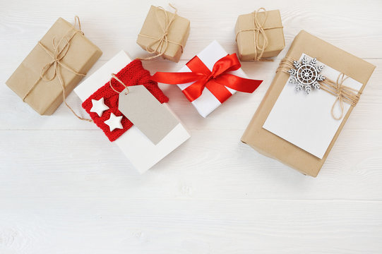 Mockup christmas background with decorations and gift boxes on wooden board. Flat lay, top view photo mock up