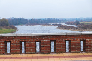 Fototapeta na wymiar Latvia. For the Venta River across to a beautiful old bridge