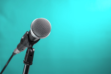 Microphone with turquoise wall background