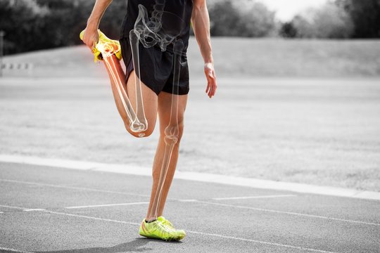 Highlighted bones of athlete man stretching on race track