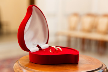 Gold wedding rings on stand for rings