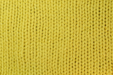 Texture of yellow woolen knitted background