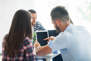 Young people using tablet for working in the office