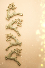 golden glitter reindeer with bokeh in christmas concept