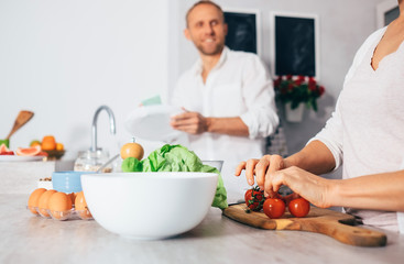 Couple on kitchen cooks together 2