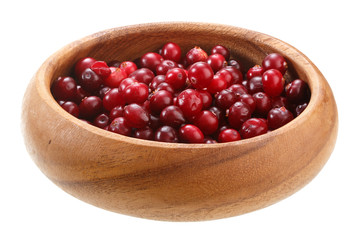 cranberries in a wooden bowl isolated on white background