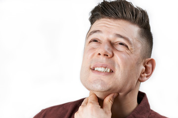 Studio Shot Of Man Suffering With Sore Throat