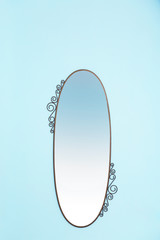 Beautiful big mirror on light wall