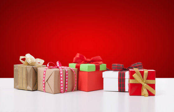 Gift boxes on white background front view. Wedding invitation, greeting card for Mother's Day. Beautiful birthday invitation. Selective focus.