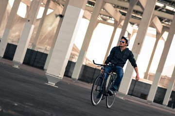 man rides a fixie bike