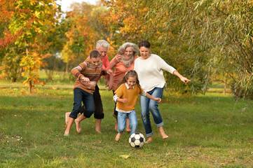 Big family playing football 