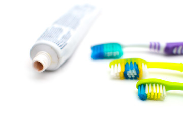On a white background lies toothpaste and brush