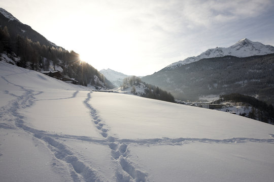 Footprints in the snow above Soelden, View to the South, Tyrol, Austria