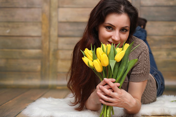 Girl with a bouquet of yellow tulips. Girl with a gift of flower