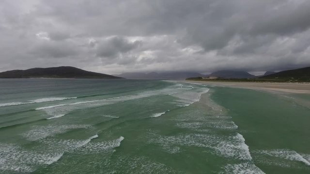 Stunning aerial schot on the Isle of Harris, Scotland, flying over turquoise water at seilebost beach