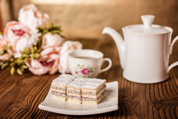 tea pot with sweet poppy seed dessert