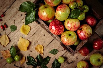 Fresh apples on an old box. Healthy food.
