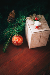 New Year's tree branches with wooden background
