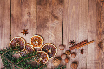 Christmas or New Year brown wooden background, Christmas food decor with fir tree.Xmas decorations, space for a text, view from above