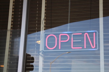 neon sign diner open red letters window