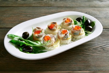 Shot of tast canapes with fish and caviar served on the wooden table at the restaurant bread delicious appetizers food eating seafood luxury cooking hungry delicacy.