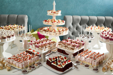 Party candy buffet table delicious sweets and desserts served at the restaurant baking bakery cheesecake festive gathering menu sugar eating food decoration celebrating.