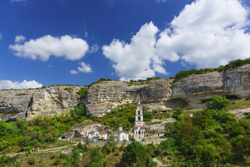 Fototapeta na wymiar The largest in the Crimea by the number of inhabitants of the Holy Dormition cave Orthodox monastery located in the natural boundary of Mariam-Dere near Bakhchisarai.