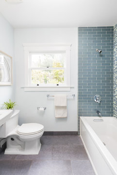 Modern bathroom with soft blue Mosaic glass tiles. 