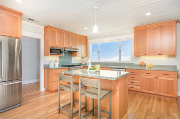 Custom designed wooden kitchen with gorgeous granite counter tops and kitchen island