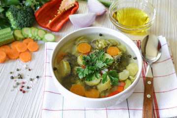 Light vegetable soup and ingredients.