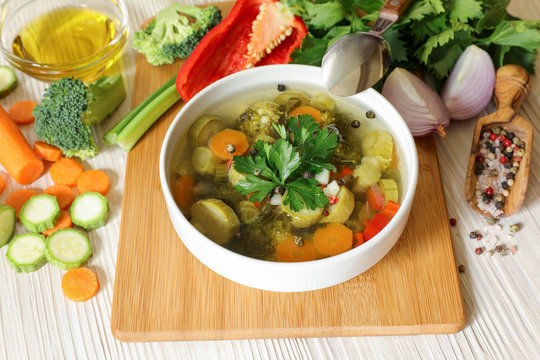 Light vegetable soup and ingredients.