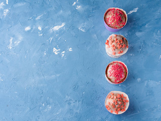 Naklejka premium Sweet Cup cakes with pink sugar sprinkles for Valentine's mother day