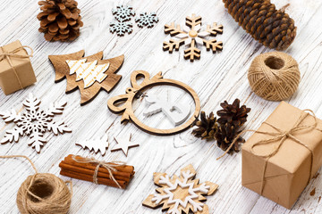 Christmas composition. Gift, christmas decoration, snowflake, pine cones. Flat lay top view