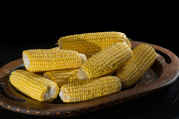 Raw sweet corn, yellow ripe corn ears