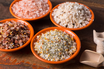 Variety of sea salt, pink Himalayan salt, colorful salt with dried chili pepper, herbs and spices.