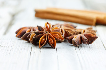 Illicium verum, star anise, staranise, star anise seed, Chinese star anise, or badiam on wooden...
