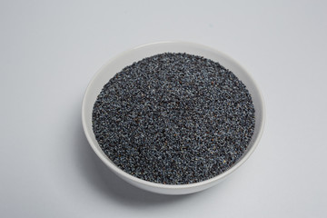 Poppy seed on white background