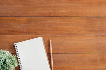 Minimal work space - Creative flat lay photo of workspace desk. Office desk wooden table background with open mock up notebooks and pens and plant. Top view with copy space, flat lay photography.