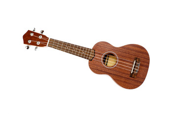 The brown ukulele on the white background - obrazy, fototapety, plakaty