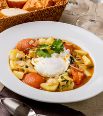 Soup with poached egg