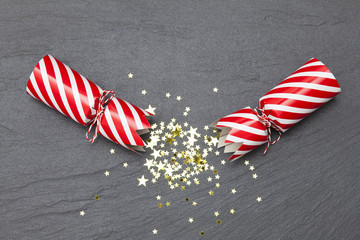 Christmas crackers on a slate background crackers