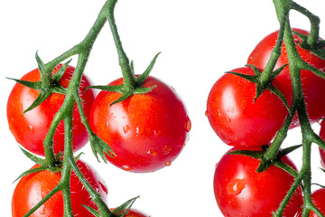 Fresh cherry tomatoes isolated over white background