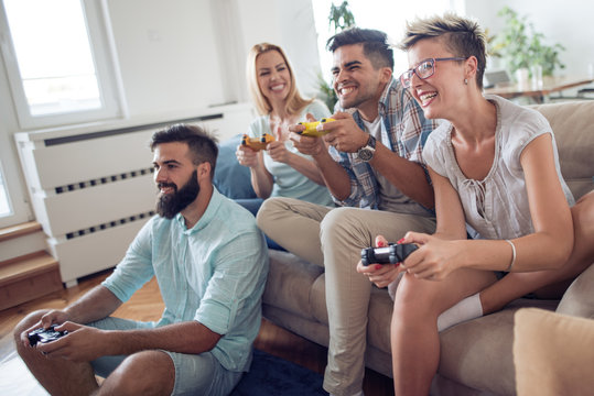 Beautiful couples playing video games on console
