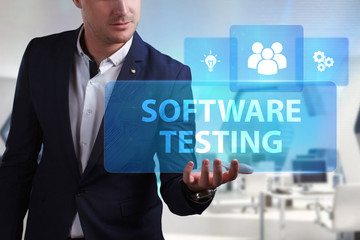Business, Technology, Internet and network concept. Young businessman working on a virtual screen of the future and sees the inscription: Software testing