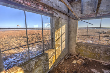 abandoned office building for rural airstrip in rural Kansas; windsock