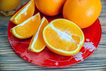oranges and orange juice on a wooden background